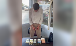 Pazarda sahte döviz ve altınlarla alışveriş yapmaya çalıştı!