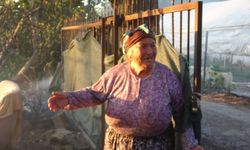 Evinin yanışını yaşlı gözlerle izledi